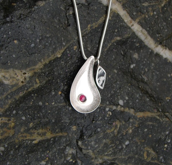 'Finding Minnow - Stirling Silver Pendant Necklace with Garnet and Arran Beach Pottery' by artist Marley McKinnie